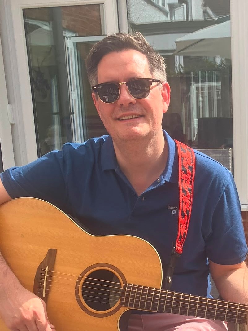 Philip Cupitt, Patent Attorney at Marks & Clerk, relaxing with his guitar.